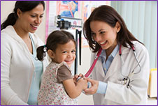 Photo of a mother and young daughter at an appointment with a pediatric doctor