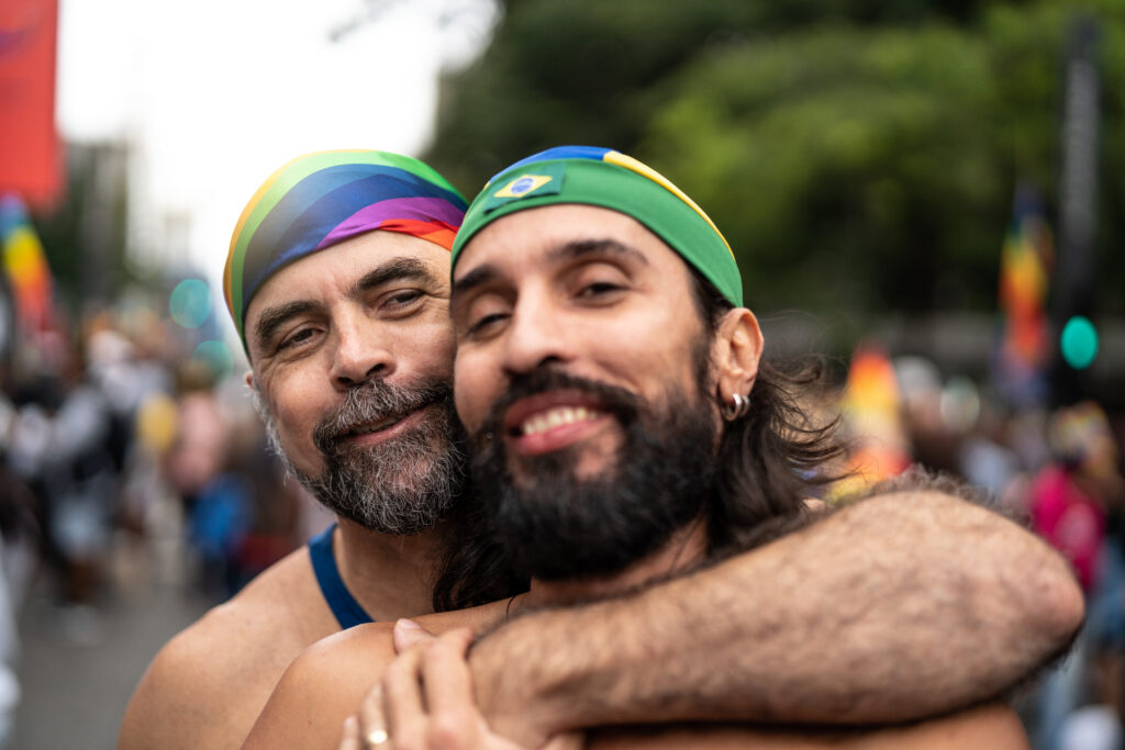 Portrait Gay couple celebrating on Gay Parade